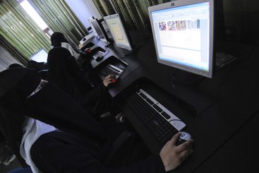 Girls use computers in Sana'a, Yemen