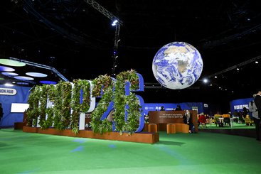 The action zone and globe at the Hydro, COP26. Karwai Tang/ UK Government / CC BY-NC-ND 2.0