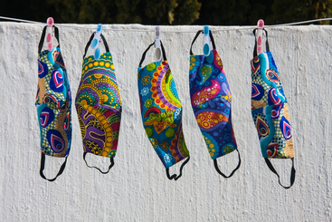 High Res Colorful South African fabric face masks for Covid-19 protection hanging out to dry on a clothesline Credit Kelly Ermis Shutterstock.png