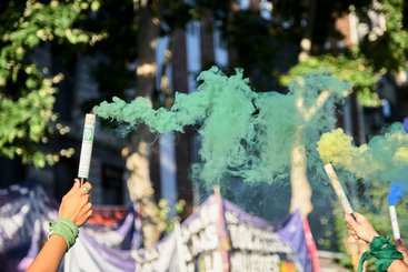 Women raising symbolic green smoke bombs take part in a rally at the National Congress, defending their legal right to safe and free abortion in Buenos Aires, Argentina, December 2020.
