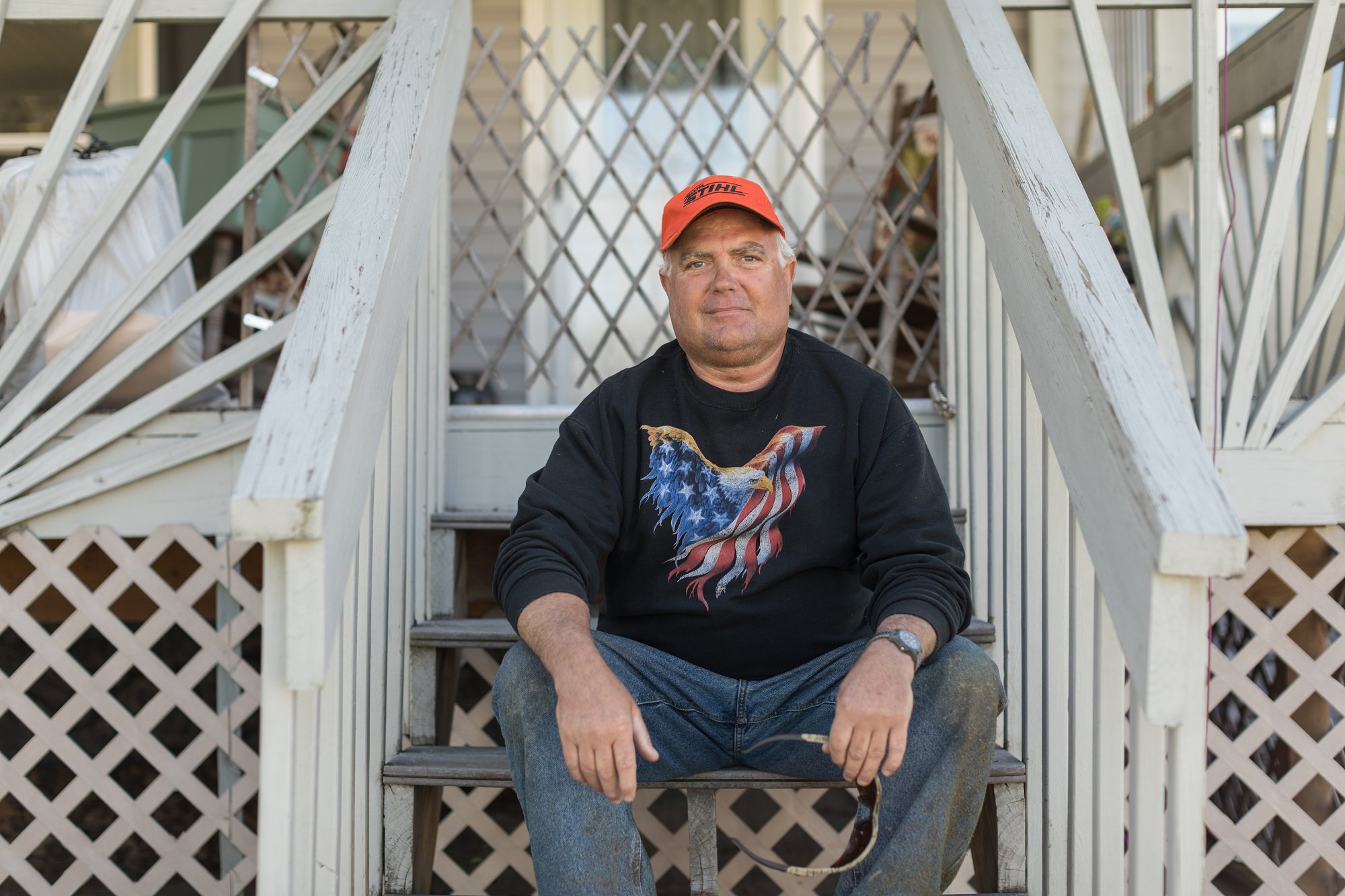 Photo: Mike, a native Virginian, sits on a porch across the street from Princeton Masjid, home of the Islamic Society of Appalachian Region in Roanoke.