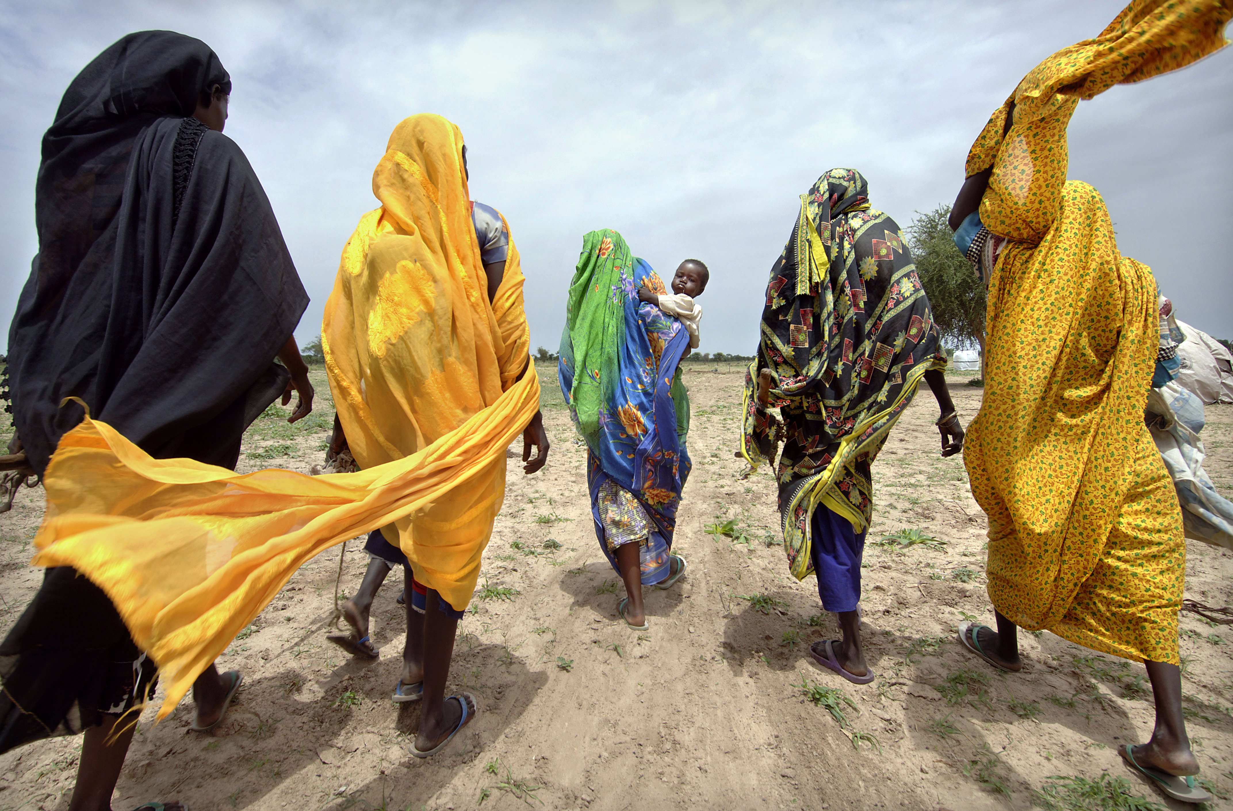 Women leaving a camp for internally displaced persons to collect firewood, Gereida, South Darfur, Sudan