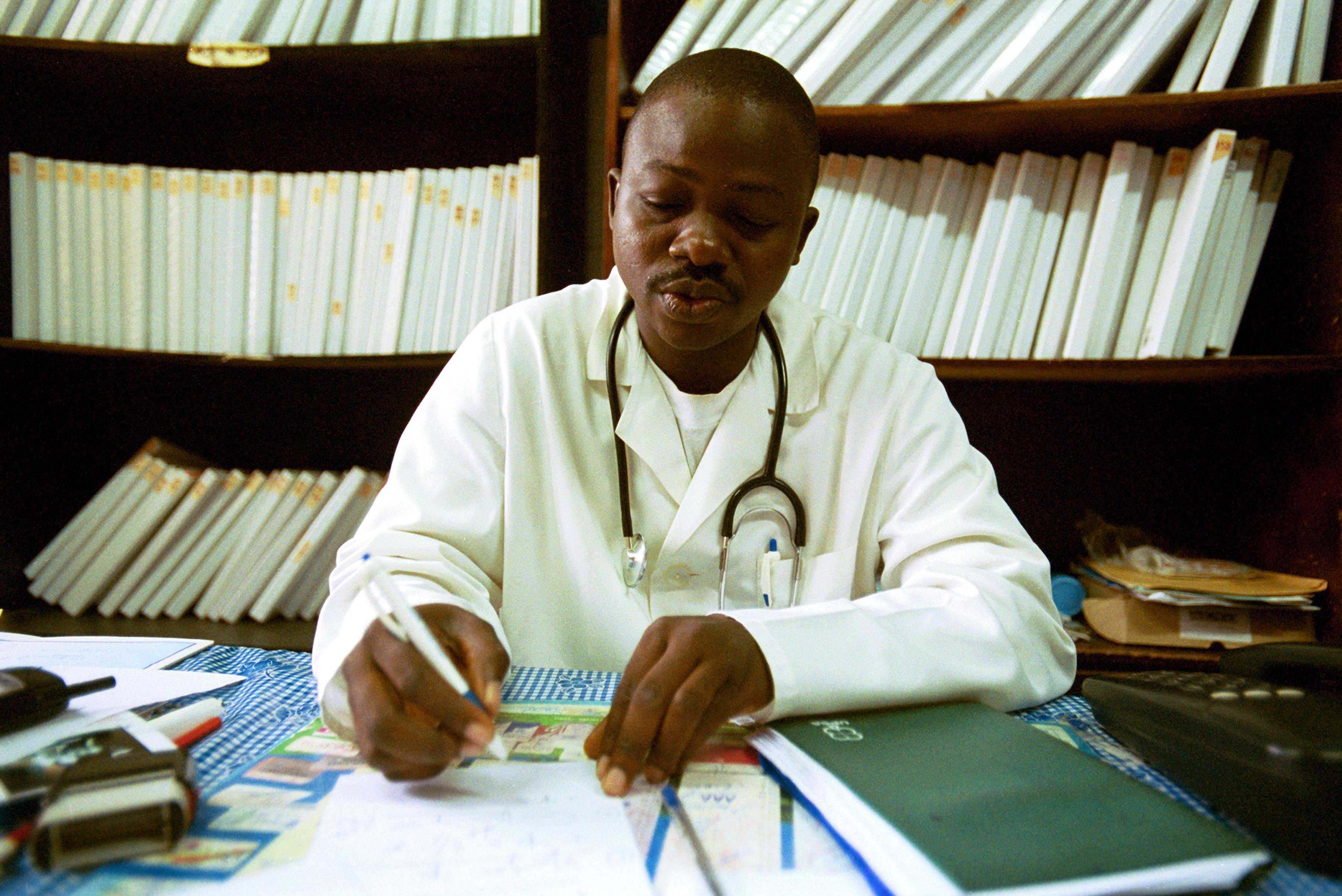 A doctor looks over medical records in Côte d&#039;Ivoire