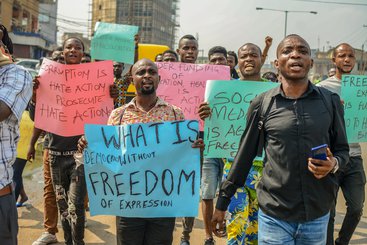 Group of men protest against the Anti-Social Media bill brought to the Nigerian Parliament, in Lagos, Nigeria, November 2019.